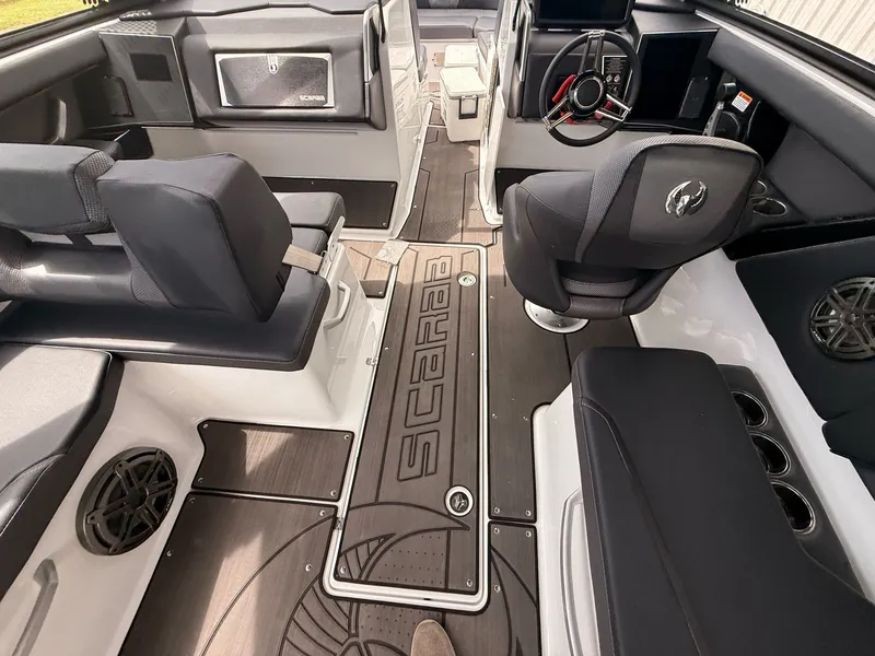 Slide: The Image of Interior of 2025 Scarab 285 LX with modern seating and steering wheel. - 5