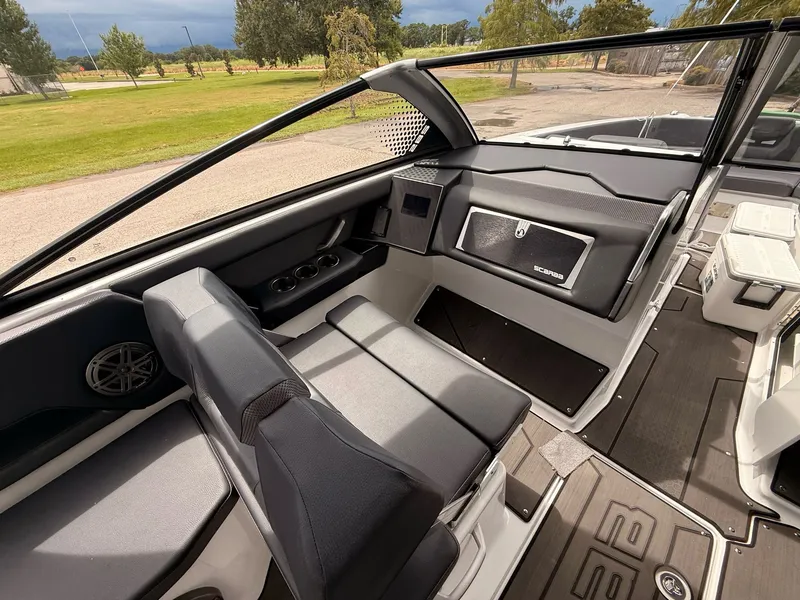 Slide: The Image of Interior of 2025 Scarab 285 LX with modern seating and dashboard. - 6