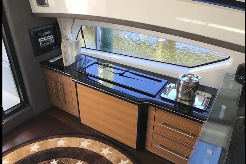 Slide: The Image of Luxurious interior of a 2014 Marquis 40 SC yacht with modern kitchen amenities. - 14