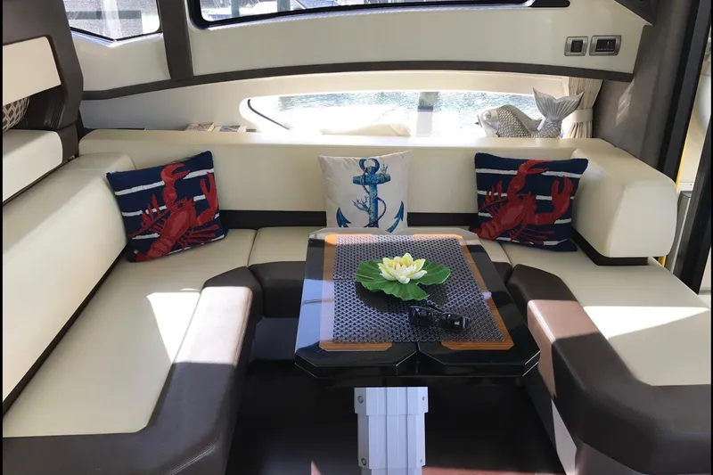 Slide: The Image of Luxurious interior of a 2014 Marquis 40 SC yacht with nautical-themed decor. - 16