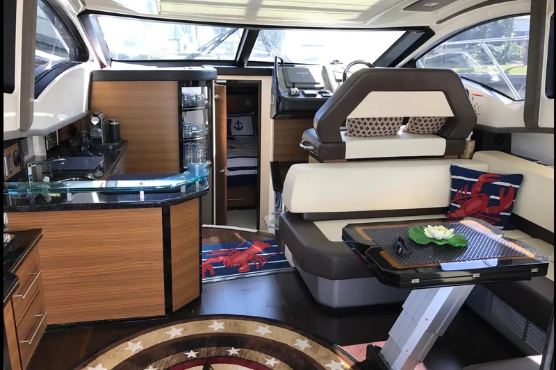 Slide: The Image of Luxurious interior of a 2014 Marquis 40 SC yacht with modern furnishings and decor. - 17