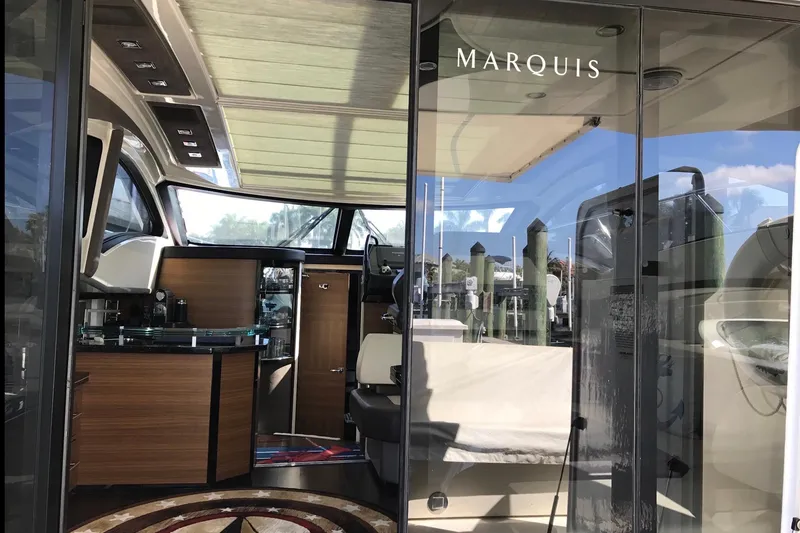 Slide: The Image of Interior view of a 2014 Marquis 40 SC yacht, showcasing modern design and luxury features. - 7