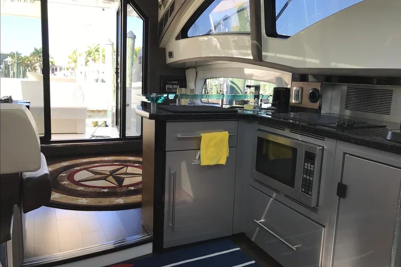 Slide: The Image of Luxurious interior of 2014 Marquis 40 SC yacht with modern kitchen amenities. - 8