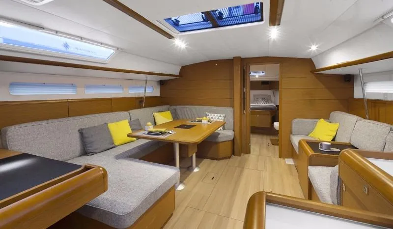 Slide: The Image of Manufacturer Provided Image: Modern interior of 2016 Jeanneau Sun Odyssey 519 sailboat with cozy seating and dining area. - 10