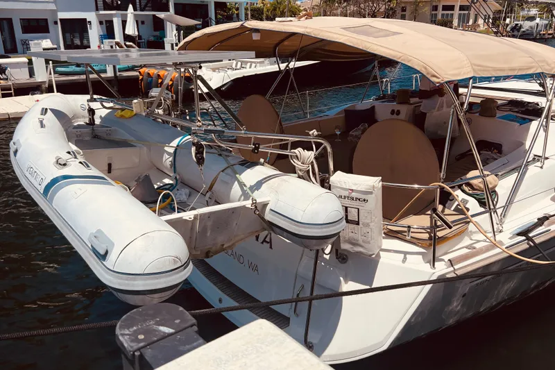 Slide: The Image of 2016 Jeanneau Sun Odyssey 519 yacht docked with inflatable dinghy attached. - 12