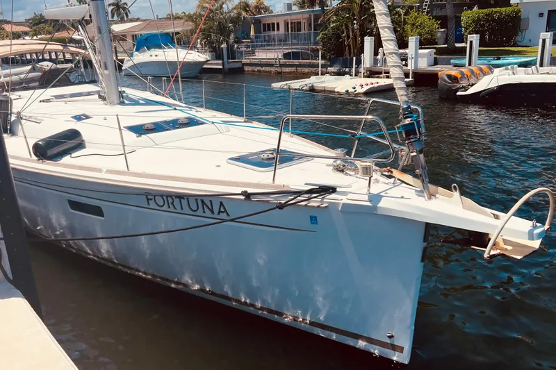 Slide: The Image of 2016 Jeanneau Sun Odyssey 519 sailboat docked in a sunny marina. - 13