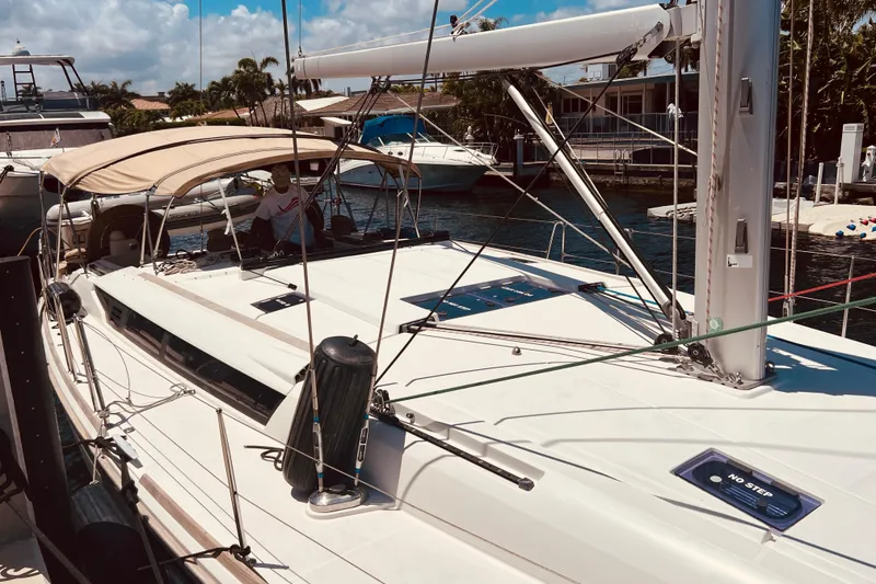Slide: The Image of 2016 Jeanneau Sun Odyssey 519 sailboat docked in a sunny marina. - 15