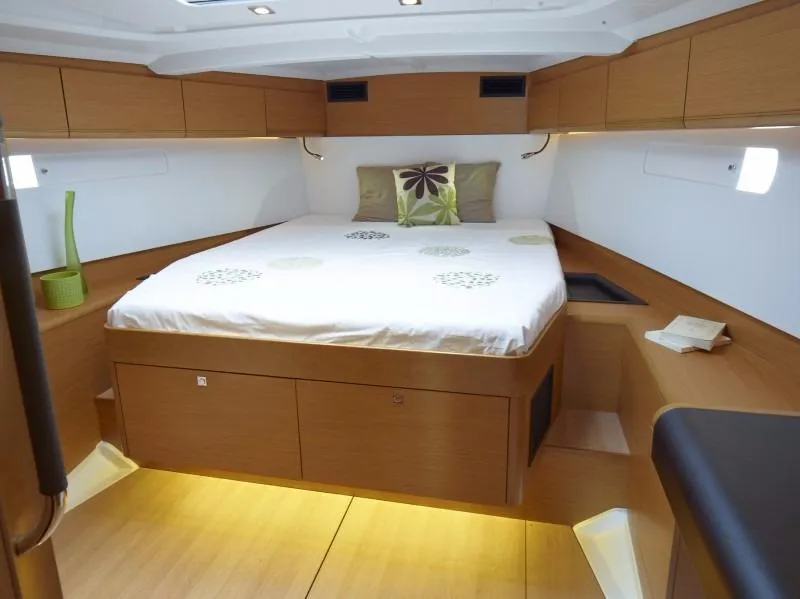 Slide: The Image of Manufacturer Provided Image: Luxurious cabin interior of 2016 Jeanneau Sun Odyssey 519 sailboat with modern wood finish. - 5