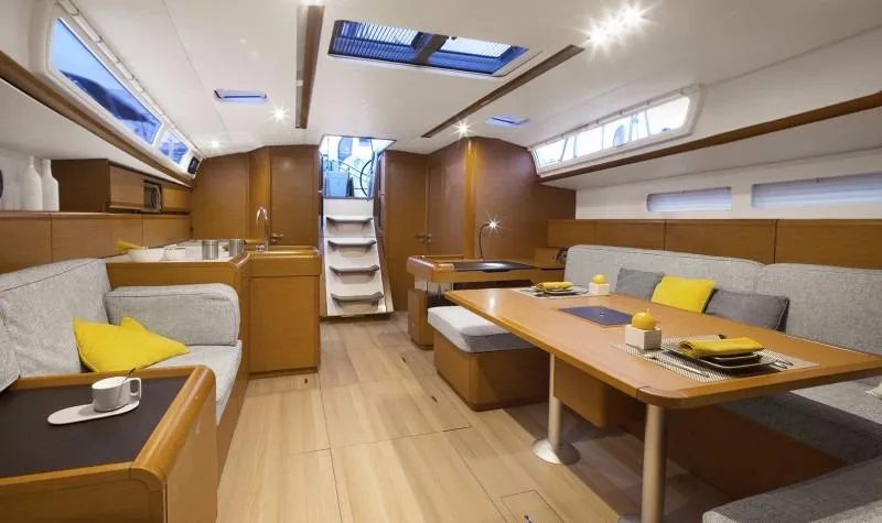 Slide: The Image of Manufacturer Provided Image: Interior of 2016 Jeanneau Sun Odyssey 519 sailboat with modern furnishings and ample natural light. - 9
