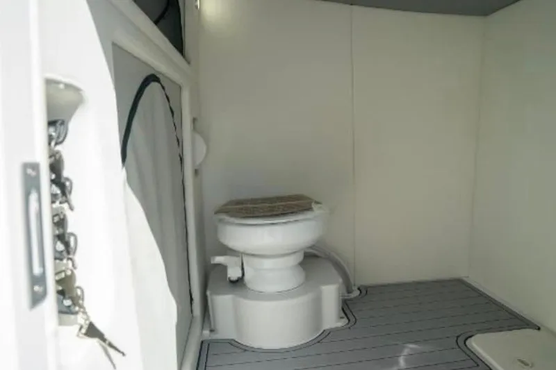 Slide: The Image of 2024 Front Runner 37 Catamaran bathroom interior with modern toilet and sleek design. - 104