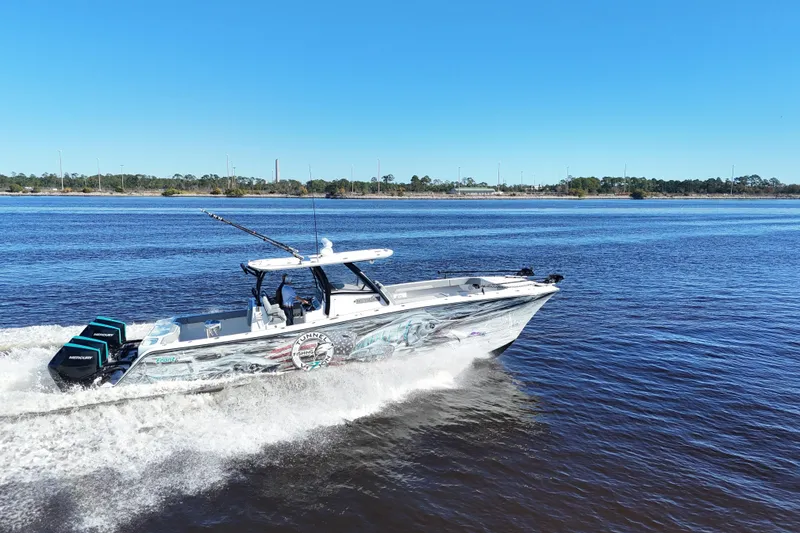 Slide: The Image of 2024 Front Runner 37 Catamaran cruising on a sunny day, showcasing sleek design and powerful engines. - 3