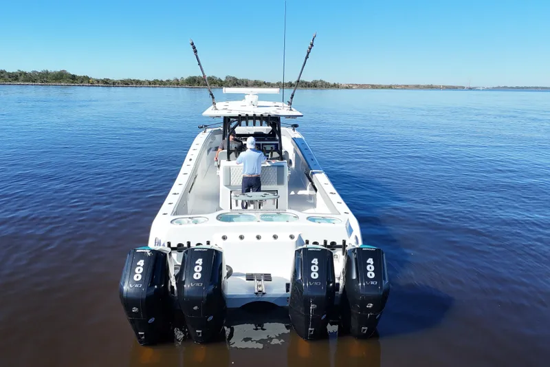Slide: The Image of 2024 Front Runner 37 Catamaran with quad 400 engines on calm water. - 50