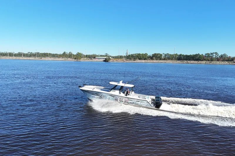 Slide: The Image of 2024 Front Runner 37 Catamaran cruising on a sunny day in open water. - 63