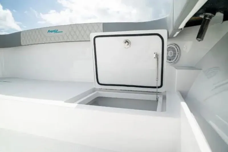 Slide: The Image of 2024 Front Runner 37 Catamaran interior storage compartment with open hatch, showcasing sleek design. - 77