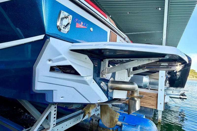 Slide: The Image of 2018 Nautique Super Air Nautique GS24 boat rear view at dock. - 13