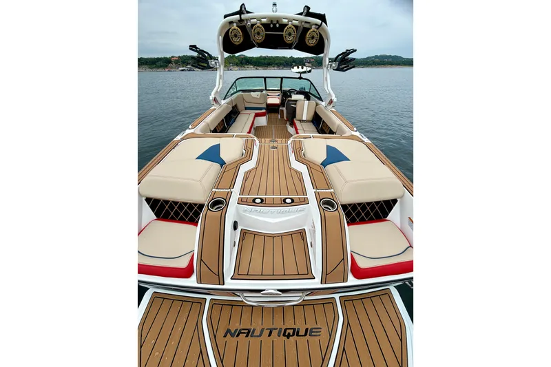 Slide: The Image of 2018 Nautique Super Air Nautique GS24 boat interior with stylish seating and teak flooring. - 17
