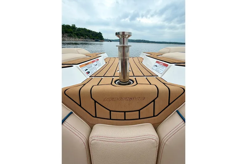 Slide: The Image of 2018 Nautique Super Air Nautique GS24 boat deck with lake view. - 18