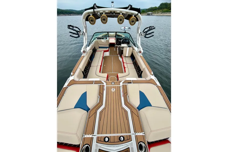 Slide: The Image of 2018 Nautique Super Air Nautique GS24 boat interior with stylish seating and advanced audio system. - 19