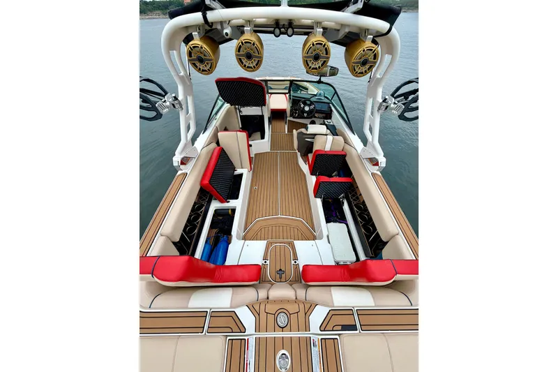 Slide: The Image of 2018 Nautique Super Air Nautique GS24 interior with red accents and premium seating. - 20