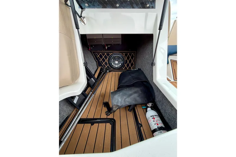 Slide: The Image of 2018 Nautique Super Air Nautique GS24 interior storage with fire extinguisher and speaker. - 35