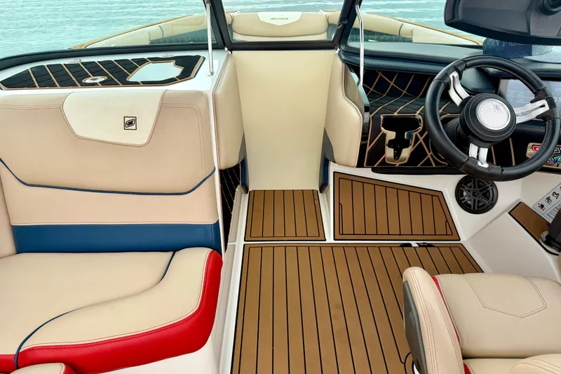 Slide: The Image of 2018 Nautique Super Air Nautique GS24 interior with sleek design and modern steering wheel. - 37