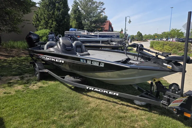 Slide: The Image of 2024 Tracker Pro Team 175 TXW boat on trailer, parked outdoors. - 7