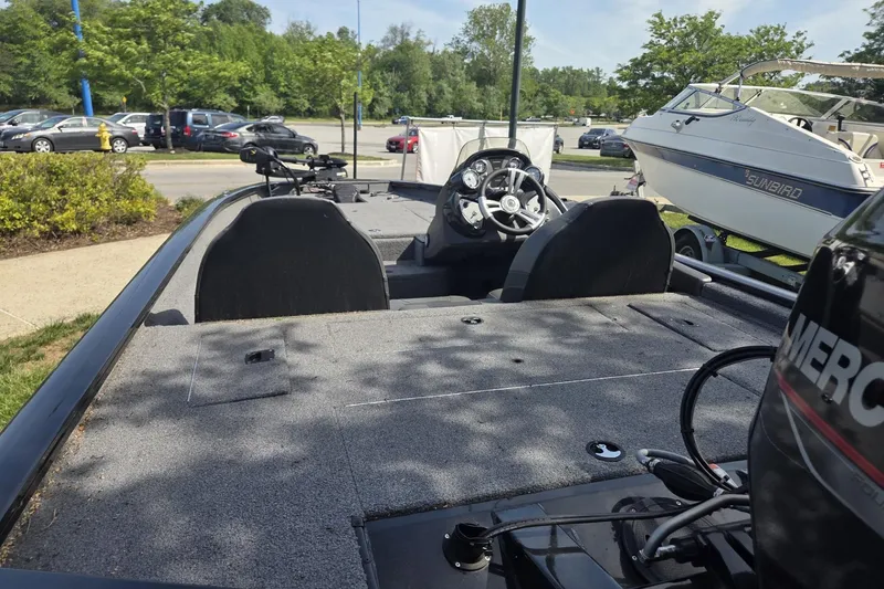 Slide: The Image of 2024 Tracker Pro Team 175 TXW boat with dual seats and steering console. - 9