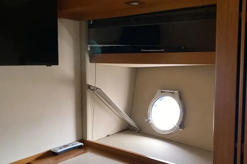 Slide: The Image of Interior of 2014 Azimut 45 yacht with porthole and TV. - 10