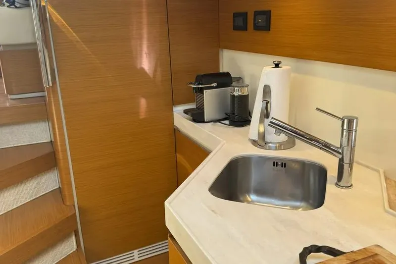 Slide: The Image of Modern kitchen area in a 2014 Azimut 45 yacht with sink and coffee maker. - 13