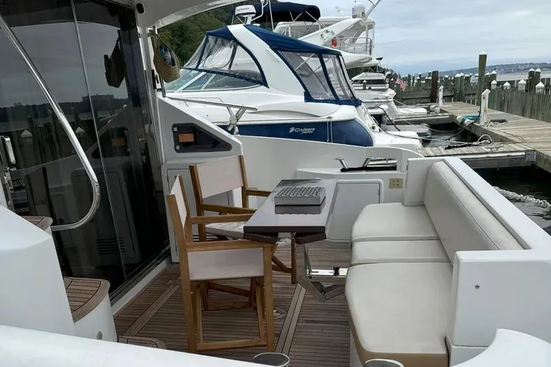 Slide: The Image of Luxury Azimut 45 yacht deck with seating and table, docked at marina, 2014 model. - 16