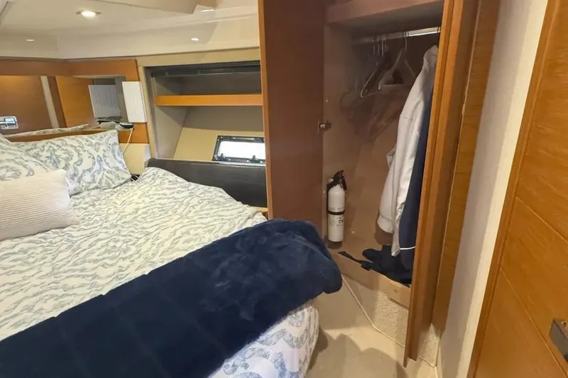 Slide: The Image of Luxurious bedroom interior of 2014 Azimut 45 yacht with cozy bedding and closet space. - 17