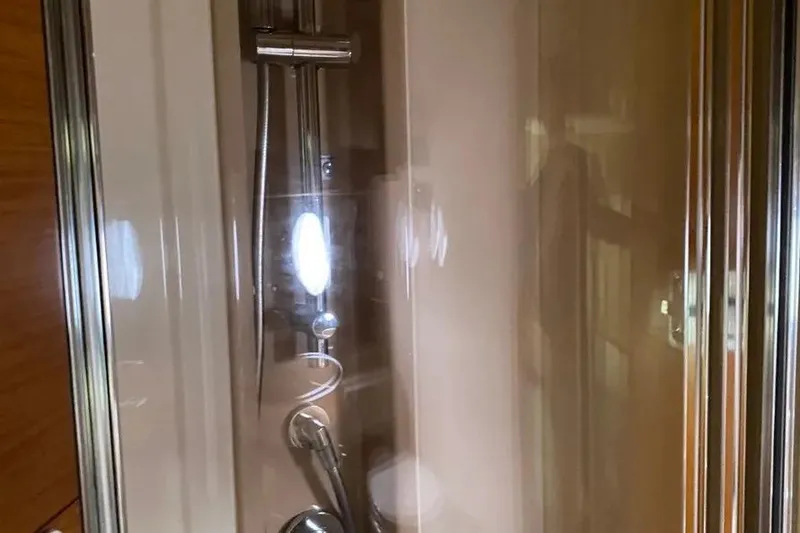Slide: The Image of Shower area inside 2014 Azimut 45 yacht, featuring sleek modern fixtures. - 18