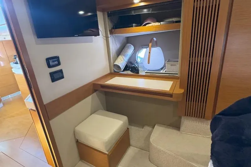 Slide: The Image of Interior of a 2014 Azimut 45 yacht with a cozy seating area and desk. - 19