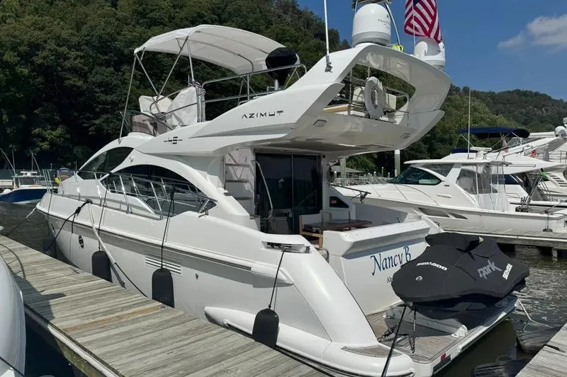 Slide: The Image of 2014 Azimut 45 yacht docked, featuring sleek design and luxury amenities. - 24