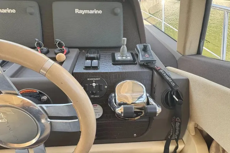 Slide: The Image of Control panel of a 2014 Azimut 45 yacht with Raymarine navigation equipment. - 25