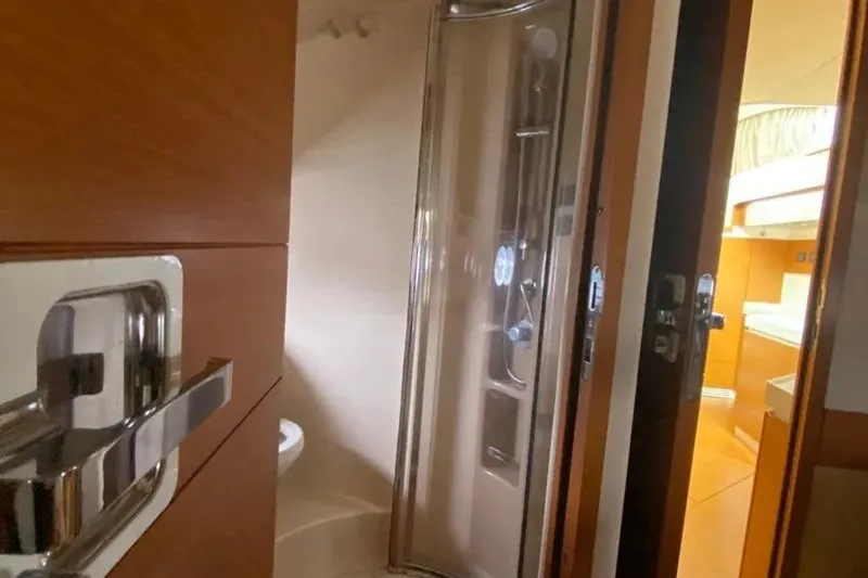 Slide: The Image of Bathroom interior of 2014 Azimut 45 yacht with modern shower and wooden accents. - 26