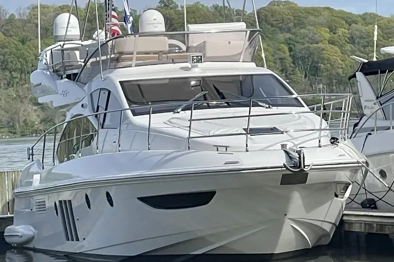 Slide: The Image of Luxury 2014 Azimut 45 yacht docked, featuring sleek design and modern amenities. - 3