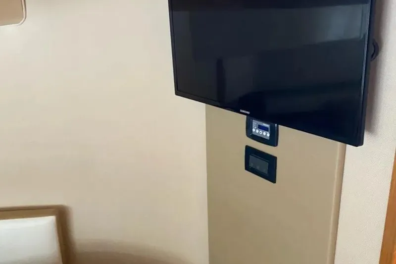 Slide: The Image of Flat-screen TV and control panel inside 2014 Azimut 45 yacht interior. - 30