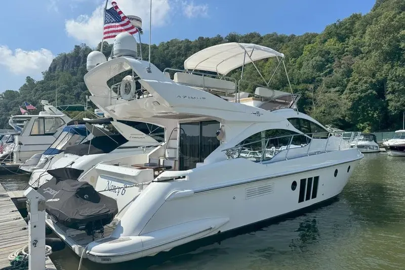 Slide: The Image of Luxury 2014 Azimut 45 yacht docked in scenic marina setting. - 4