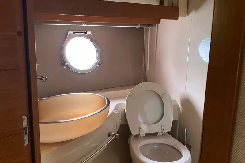 Slide: The Image of Bathroom interior of a 2014 Azimut 45 yacht with porthole and modern fixtures. - 40