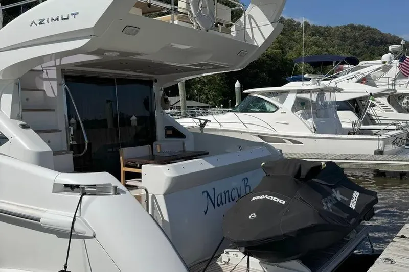 Slide: The Image of Luxury 2014 Azimut 45 yacht docked with covered Sea-Doo jet ski nearby. - 41