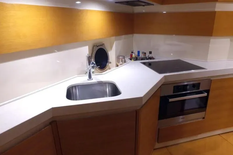 Slide: The Image of Modern kitchen interior on a 2014 Azimut 45 yacht, featuring sleek countertops and appliances. - 42