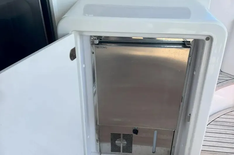 Slide: The Image of Open refrigerator on 2014 Azimut 45 yacht, showcasing stainless steel interior. - 43