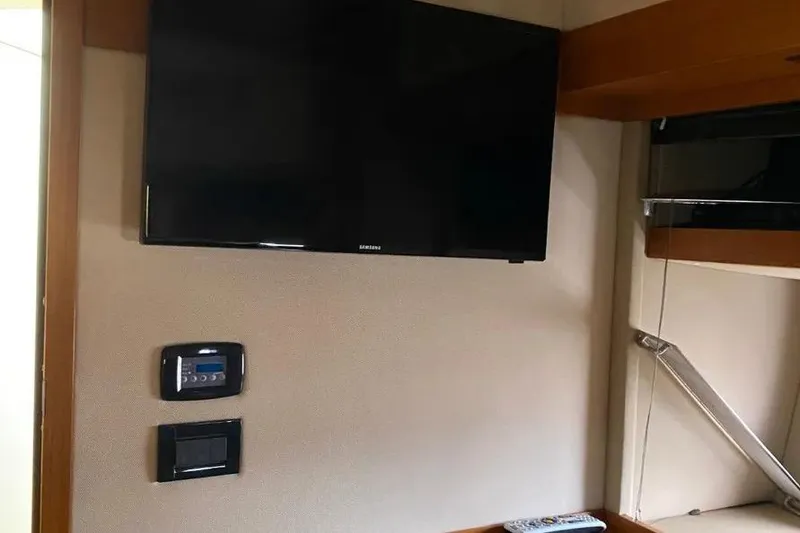 Slide: The Image of Interior of 2014 Azimut 45 yacht with wall-mounted Samsung TV and control panel. - 45