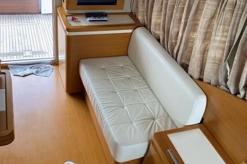 Slide: The Image of Interior of 2014 Azimut 45 yacht with white leather seating and wooden accents. - 46