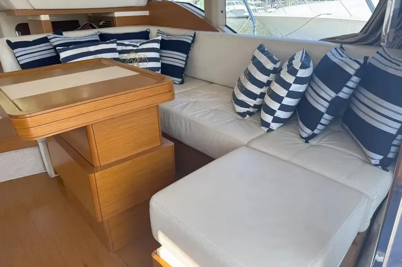 Slide: The Image of Luxurious interior of 2014 Azimut 45 yacht with striped cushions and wooden table. - 47