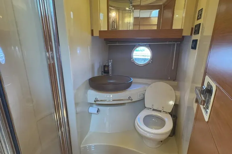 Slide: The Image of Luxurious bathroom in 2014 Azimut 45 yacht with modern fixtures and porthole window. - 49