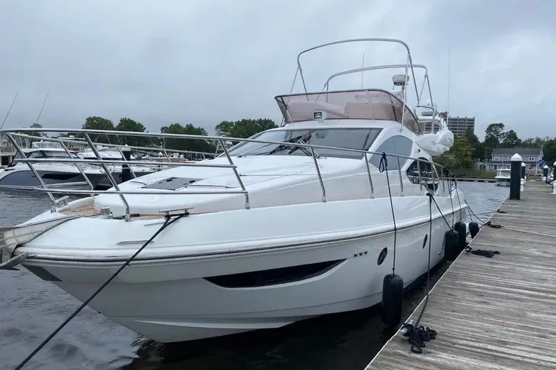 Slide: The Image of 2014 Azimut 45 yacht docked at marina, showcasing sleek design and modern features. - 53