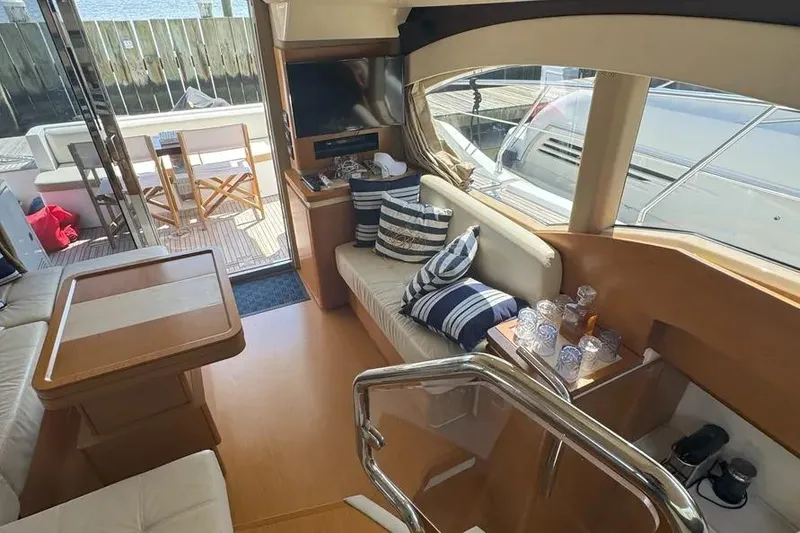 Slide: The Image of Interior of 2014 Azimut 45 yacht with cozy seating and nautical decor. - 6