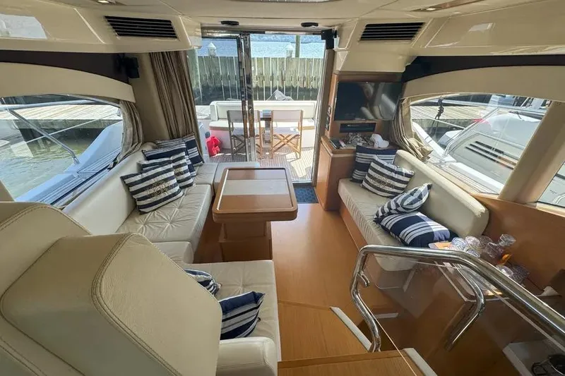 Slide: The Image of Luxurious interior of 2014 Azimut 45 yacht with elegant seating and striped cushions. - 61
